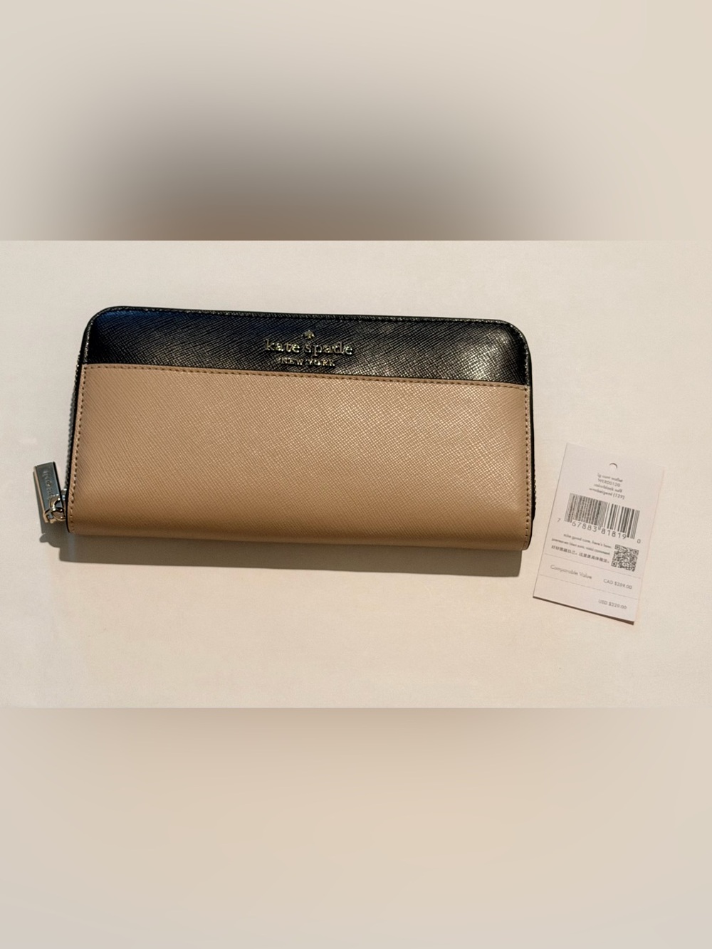 New Kate Spade tan and black zip-around continental wallet